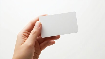 Hand displaying a credit card, business card, or voucher against a white background, ideal for use as a template or mock-up