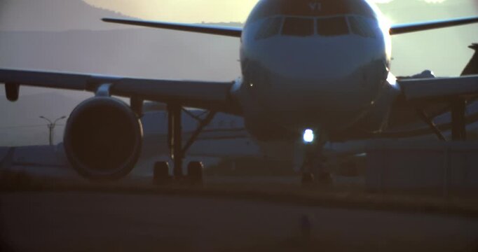 Slow motion video of a plane driving onto an airport runway. Transportation and transportation of passengers by airliners. High quality 4k footage