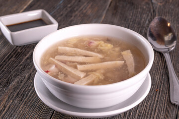 Chinese Tofu Vegetable Soup on wood table. Chinese food.