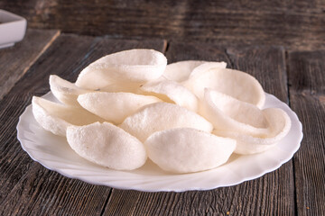 rice chips on wood table. Chinese food.