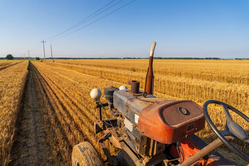combine harvester working on a wheat field