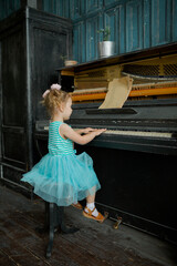 little girl playing piano