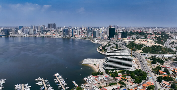 Aerial view of Luanda's waterfront and cityscape in Angola under a clear sky