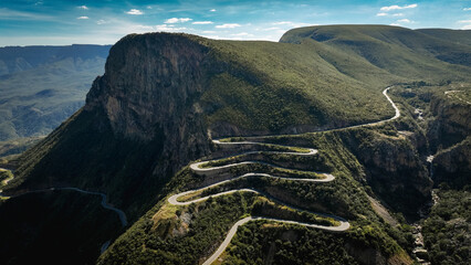 Serra da Leba Road winding through the lush hills of Angola on a clear day