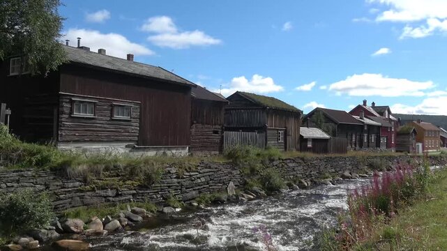 Old historic buildings along the river in R&oslash;ros, Norway.