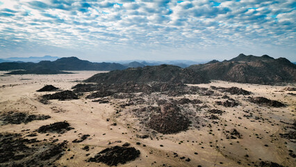 Vast landscape of Iona National Park in Angola showcasing rocky terrains and unique cloud formations