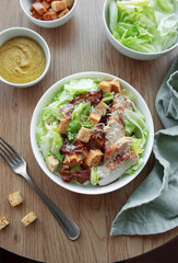 A bowl  of  Caesar salad