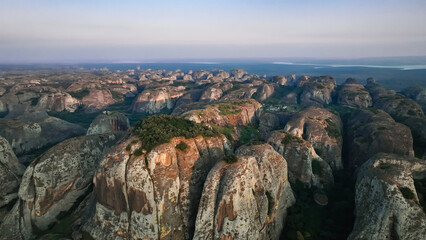 Stunning aerial view of Pedras Negras Mountains in Angola during sunset showcasing dramatic rock...