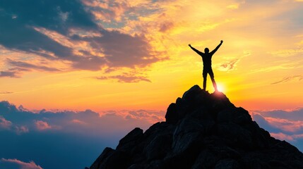 Man on top of a Mountain at Sunset