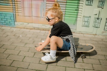 little girl with skateboard 