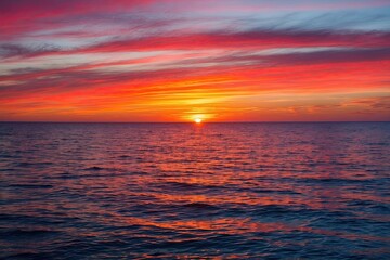 Fototapeta premium Stunning Ocean Sunset with Colorful Horizon and Tranquil Waters