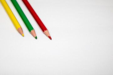 colored pencils for drawing and coloring. red, yellow, green pencils