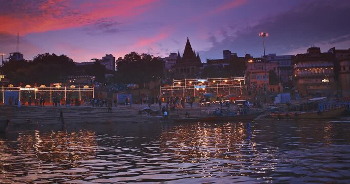 Varanasi, India. Hundreds Of Tourists And Locals Gather On Boats To Watch Fire Ceremony Or Puja At Assi Ghat. Ganga Maha Aarti Ceremony. Traditional Ganga Aarti In Varanasi. Cinematic Camera Movement