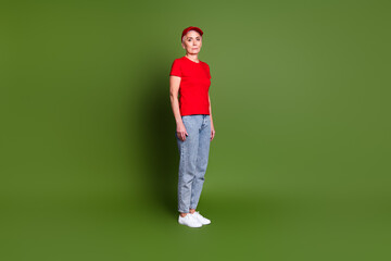 Full length photo of lovely pensioner lady delivery service employee stand dressed red uniform workwear isolated on khaki color background