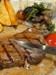 Luxurious and glorious sirloin steak dinner with premium sides a feast for the senses along with potatoes, sauces and condiments good for recipes and cook book content