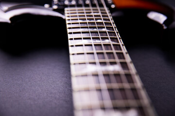 Fretboard of modern electric guitar. Close up.	