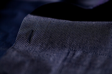 Close up of dark Men's shirt. Soft focus. Copy space.	