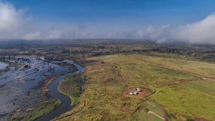 Aerial view of farmlands and rivers in Angola showcasing diverse agricultural landscapes