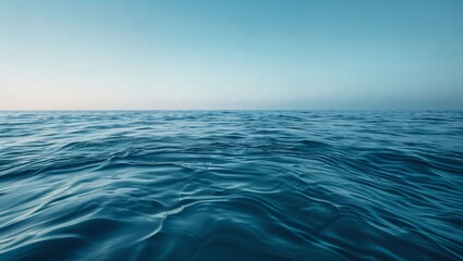 Fototapeta premium Serenity Unveiled: A Tranquil View of the Endless Sea Reflecting the Clear Sky, Where Soft Waves Gently Embrace the Horizon, Inviting Peacefulness and Contemplation.