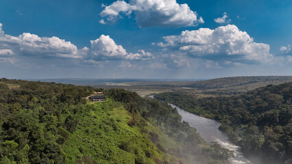 Aerial view of the Calandula Waterfall river landscape in Angola with lush greenery and dramatic...