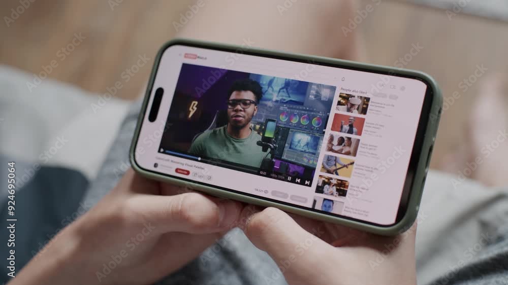 Poster video sharing platform with blogger content about color correction displayed on smartphone screen. c