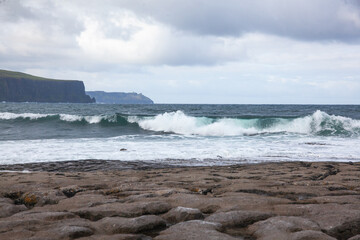waves crashing on rocks
