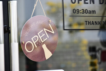 open sign on the door of shop