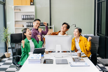 Fototapeta premium Happy businesspeople while collaborating on a new project in an office. Group of diverse businesspeople