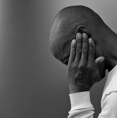 deafness suffering from hearing loss on gray black background with people stock image stock photo	