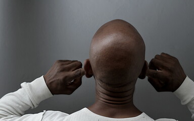 deafness suffering from hearing loss on gray black background with people stock image stock photo	
