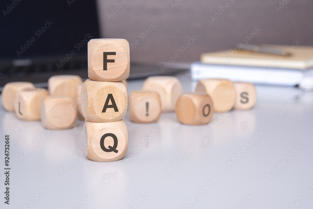 Poster wooden blocks on a desk to illustrate the faq concept for easy viewing and reference