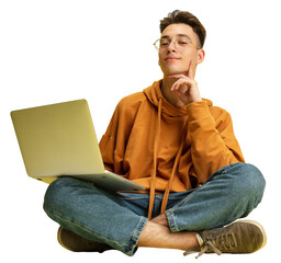 Studying, doing homework. One young smiling Caucasian man, student in glasses sits on floor with...