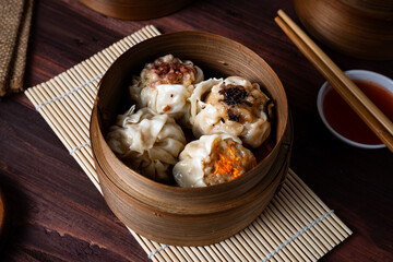 Dimsum. Chinese meal made from chicken, fish, or shrimp meat covered with dimsum skin. Perfect for recipe, article, catalogue, or any cooking contents.