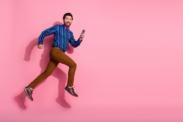 Photo of crazy cheerful elegant man wear trendy clothes hurrying empty space isolated on pink color background