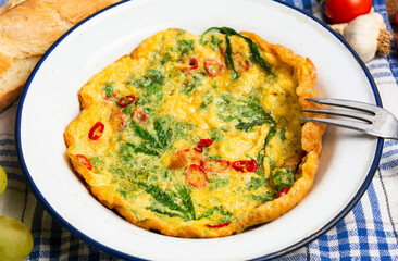 Egg omelet with marijuana leafs on a plate