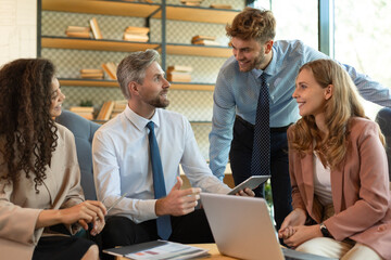 Business team discussing together business plans in office.