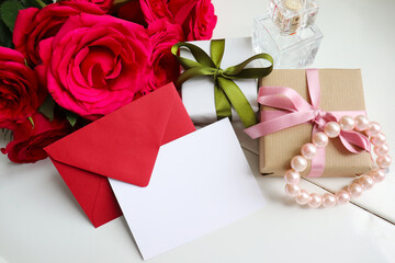 gift concept. beautiful gift boxes with bows and a bouquet of red roses