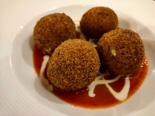 Crispy Sicilian Arancini with Tomato Sauce: Traditional Italian Fried Rice Balls