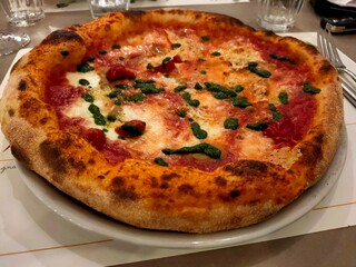 Authentic Neapolitan Margherita Pizza with Mozzarella and Basil in Italian Pizzeria