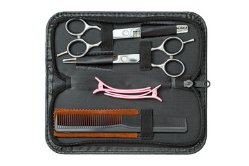 Set of Professional haircutting scissors of high-quality stainless steel with sharp blades and ergonomic finger holes for easy handling for barbers to trim the hair in a salon, on white background