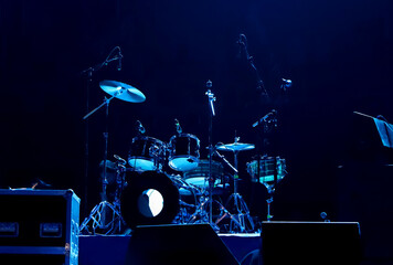 Drum kit on stage at night