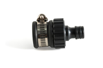 Black adapter for connection of a garden hose with watering system isolated on a white background, Clipping path included easy to use.