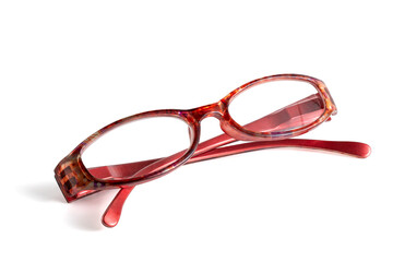 Reading glasses, isolated on a white background. The glasses have a bold red frame, a blend of functionality and style, with practical eyeglasses.