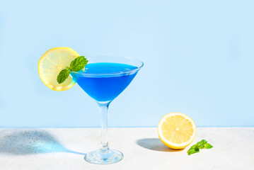 Blue cocktail with mint and lemon