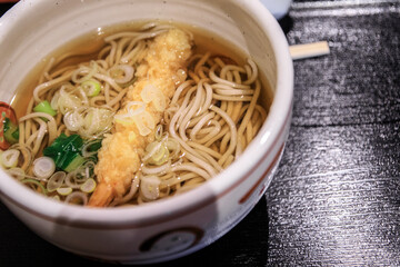Savoring the Warmth of Traditional Japanese Noodle Soup with Tempura Shrimp