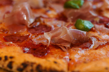 Pizza with salami and prosciutto. Meat pizza with cheese