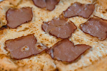 Pizza with salami and prosciutto. Meat pizza with cheese