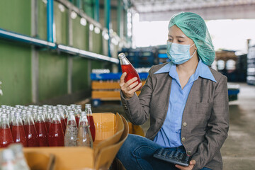 Food and drinks beverage factory industry manager working, Products QC audit staff quality control product inspector checking process drinks bottle.