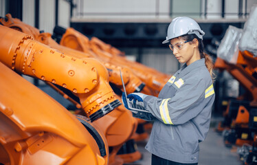 Engineer woman working in advance machine factory. Indian female engineering staff work checking...