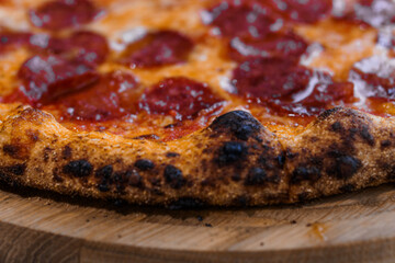 Pizza with salami and prosciutto. Meat pizza with cheese